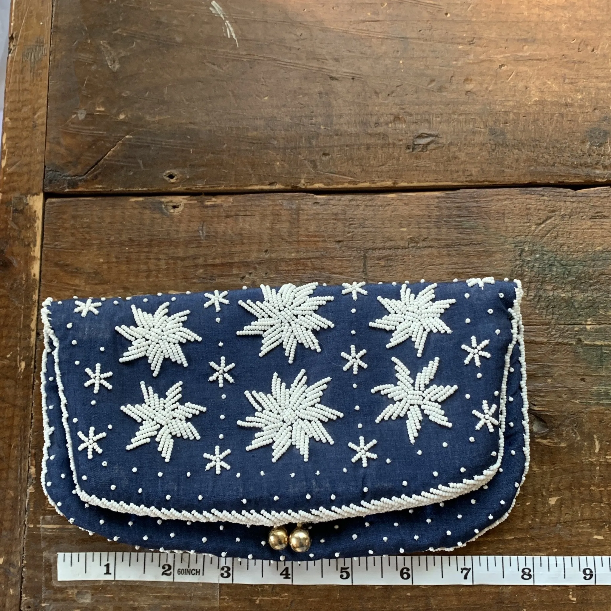 Vintage Navy Blue Clutch with White Beading in a Floral Pattern by Saks Fifth Avenue.