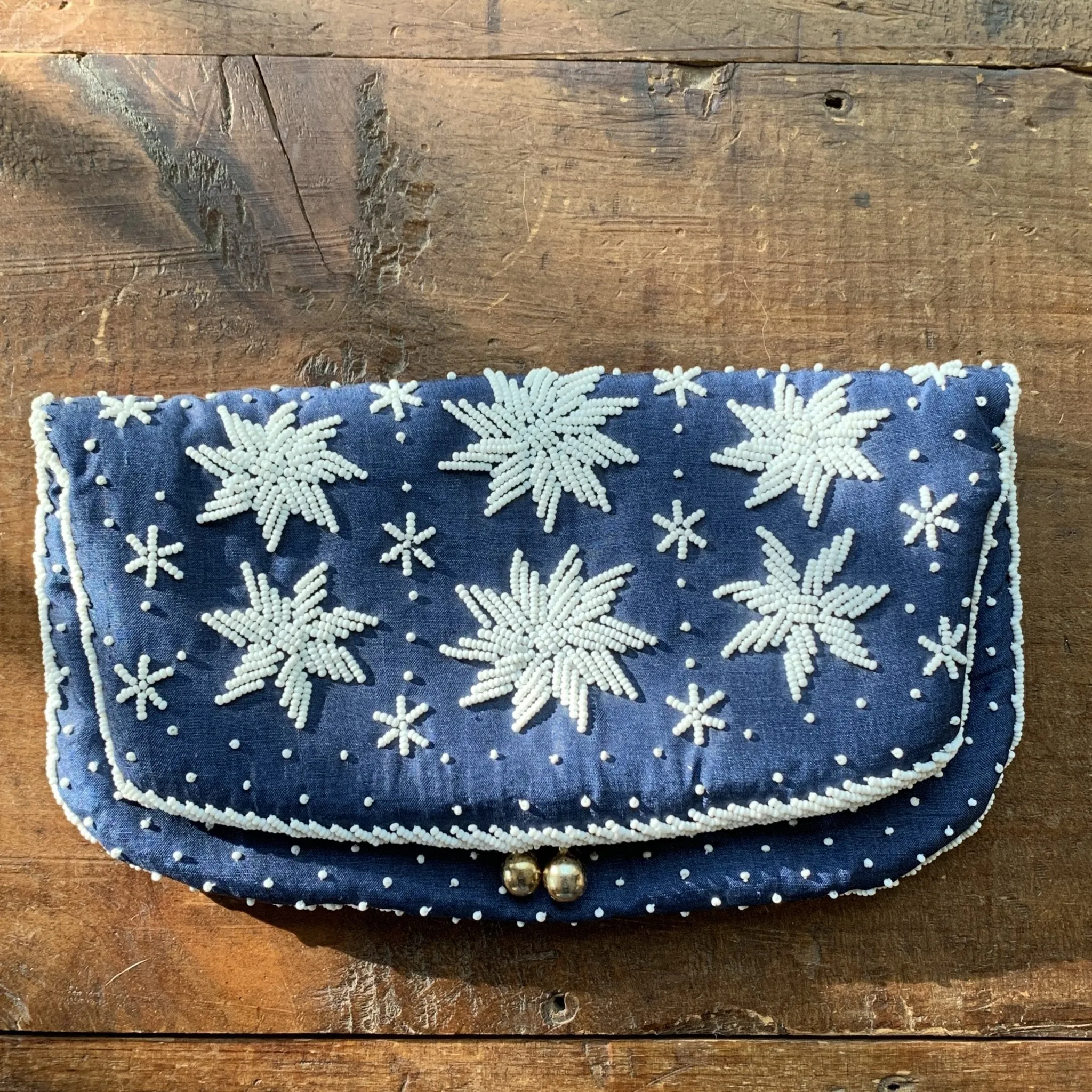 Vintage Navy Blue Clutch with White Beading in a Floral Pattern by Saks Fifth Avenue.