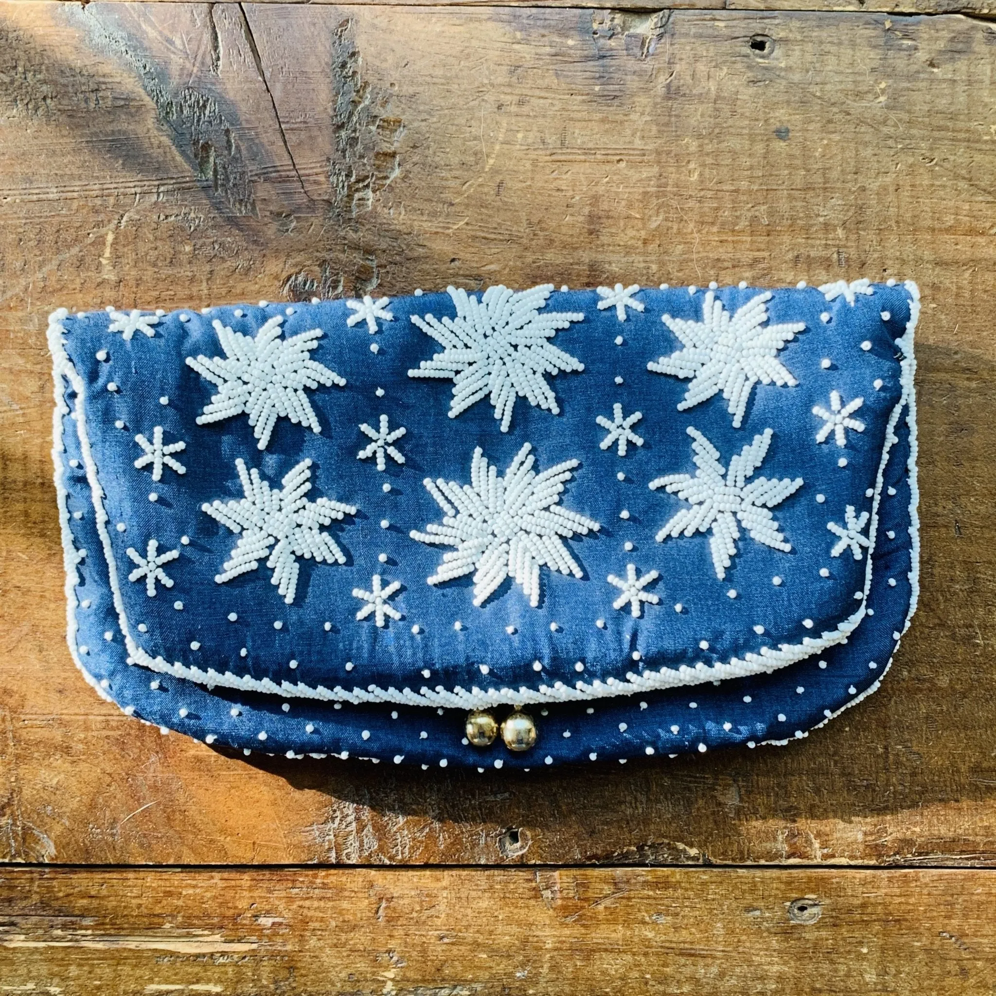 Vintage Navy Blue Clutch with White Beading in a Floral Pattern by Saks Fifth Avenue.